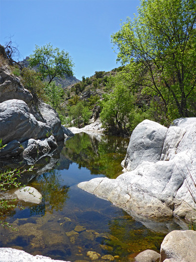 Reflective pool surrounded by white rocks