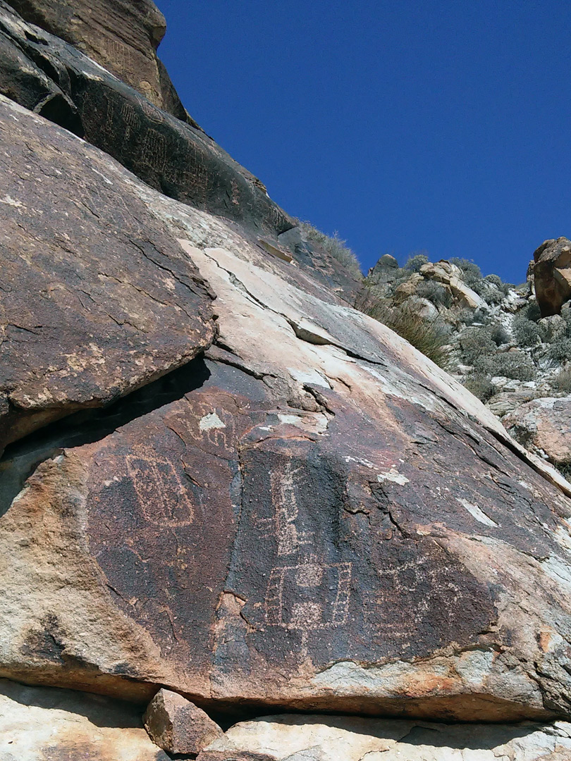 Petroglyphs on a sloping cliff