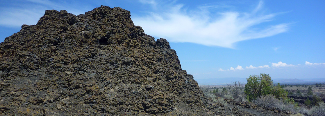 Thin clouds above one of the Fleener Chimneys, Lava Beds NM