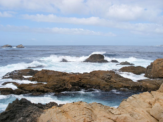 Waves breaking over rocks at the edge of Soberanes Point