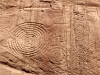 Three spiral petroglyphs