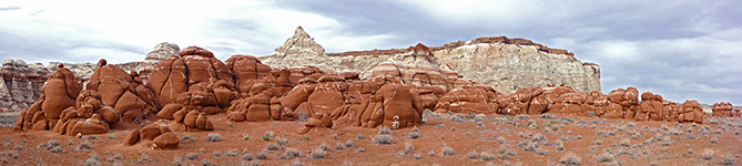 Red boulders and bluish-white cliffs