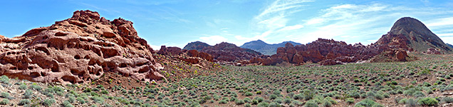 Red mounds and a sagebrush valley