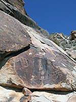 Petroglyphs on a sloping cliff
