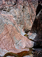 Water flowing over bare rock