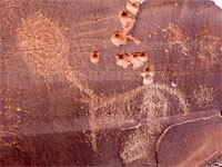 Petroglyph and bullet holes