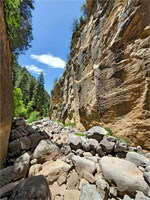 Boulders below cliffs