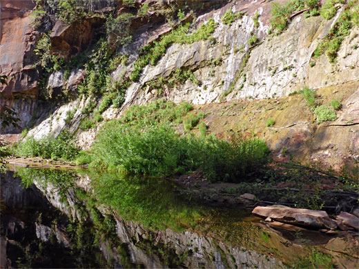 Overhanging red rocks near the start of the trail