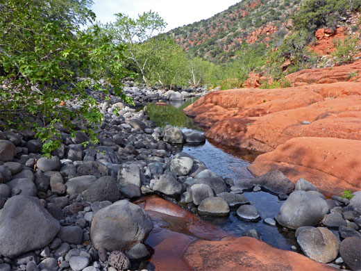 Smooth grey boulders in the stream