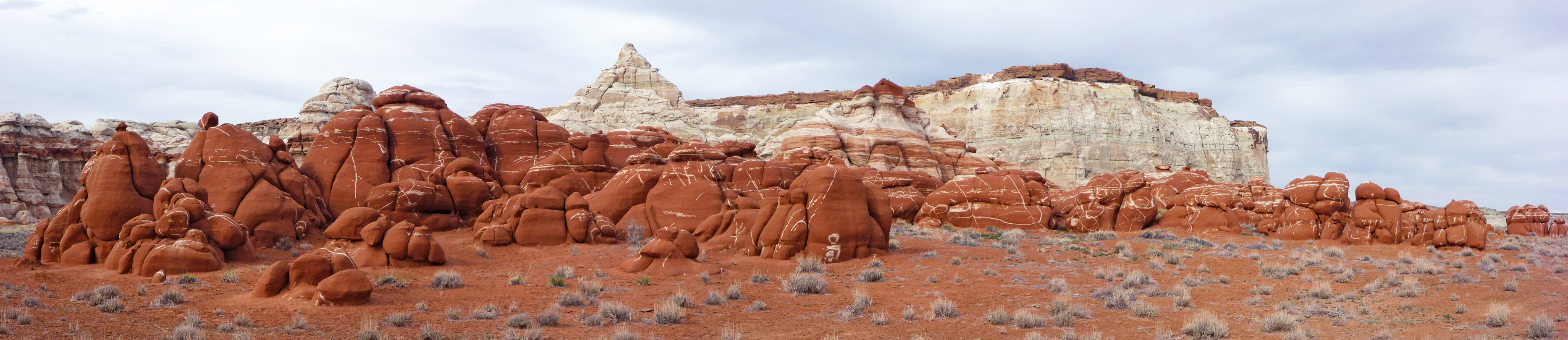 Red boulders and bluish-white cliffs