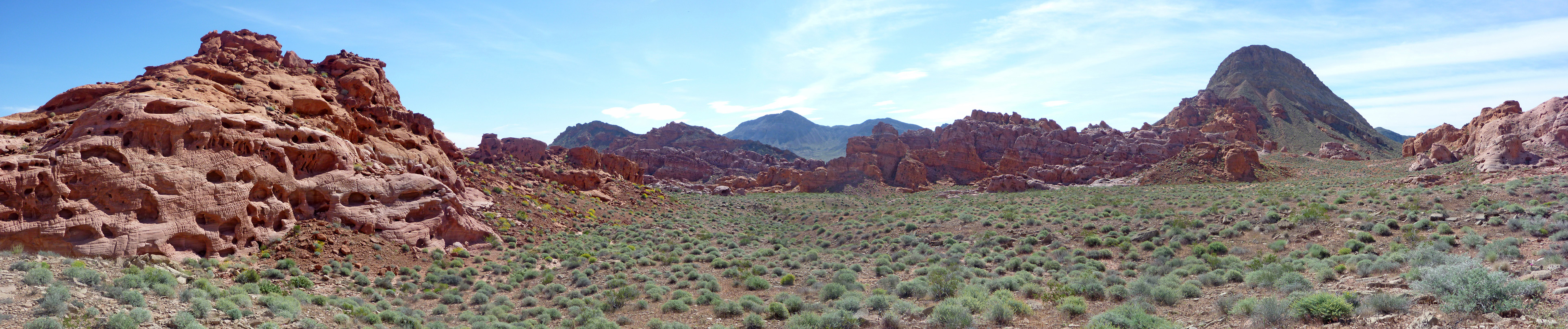 Red mounds and a sagebrush valley