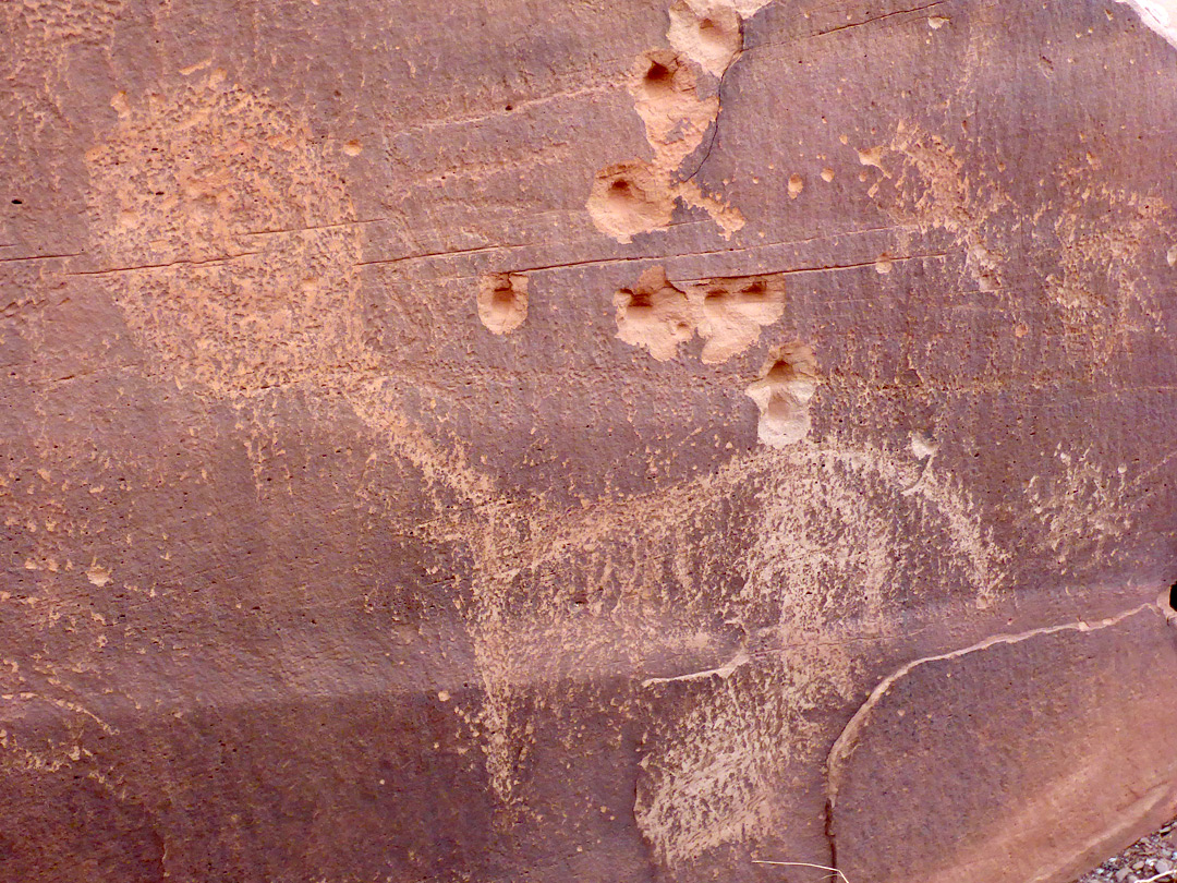 Petroglyph and bullet holes