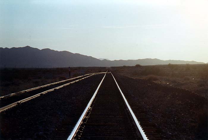 Sunset over a railroad beside AZ 72