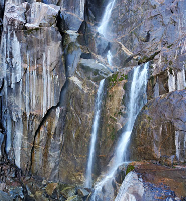 Streaked cliffs and streams of water