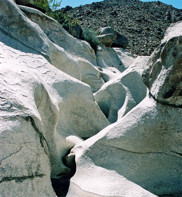 Water-polished monzonite rock