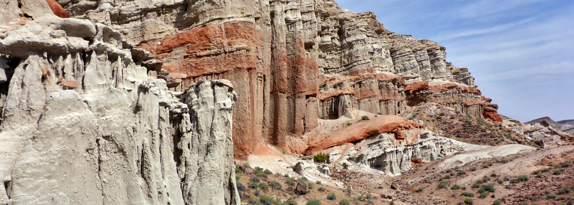 Red and greyish cliffs on the west side of Hwy 14