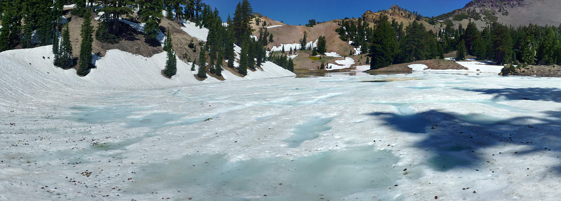 The snow-covered south side of Ridge Lake