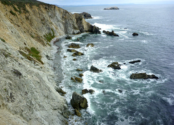 Narrow, inaccessible pebble beach at Tomales Bluff