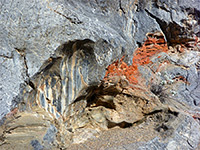 Red rock surrounded by grey