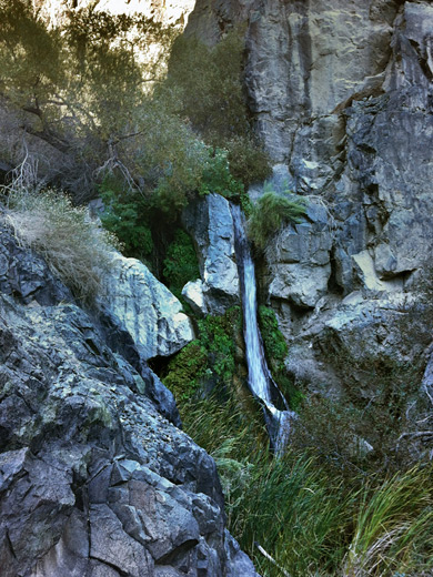 Dark grey cliffs around Lower Darwin Falls