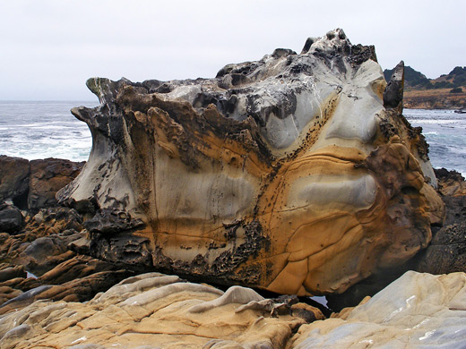 Eroded, multicolored sandstone boulder