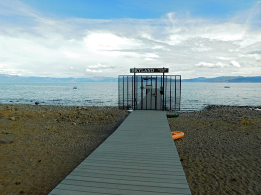 Beach boardwalk leading to a small pier, at Skyland