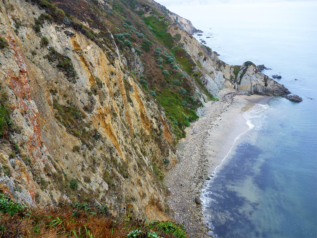 Colorful cliffs above a narrow beach