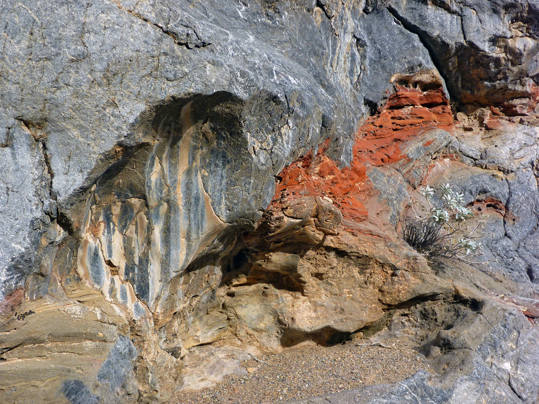 Red rock surrounded by grey