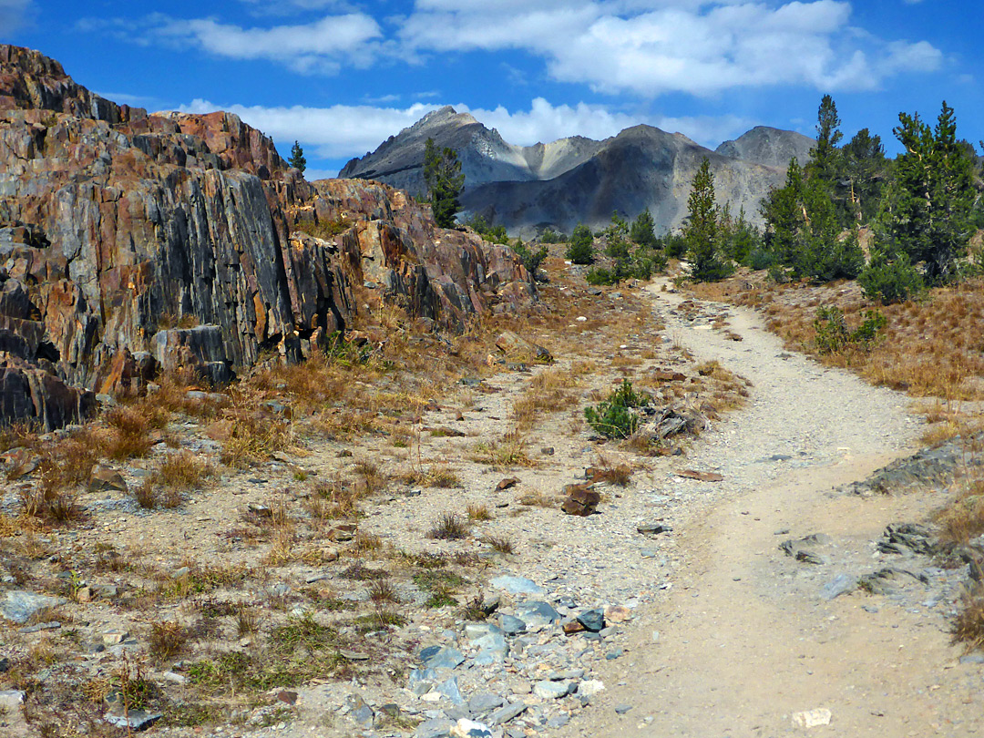 Path alongside reddish rocks