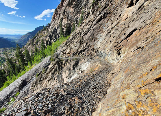 Curving path across slate cliffs
