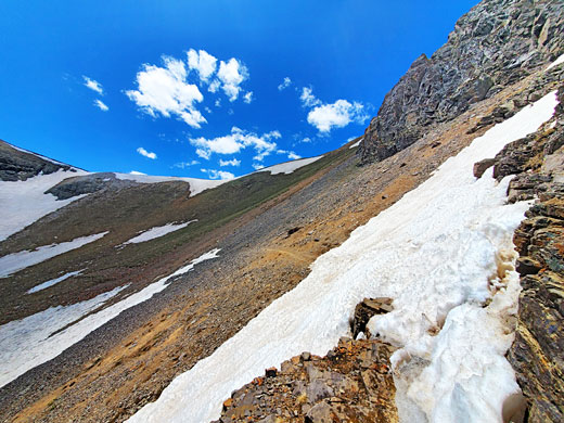 Path across scree, approaching the saddle above the lower basin