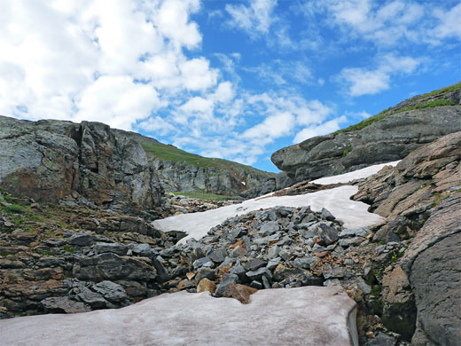 Grey rocks and residual snow