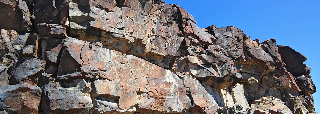 Petroglyphs at the White River Narrows Site, on a cliff of fractured basalt