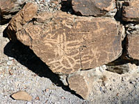 Petroglyphs beside a dryfall