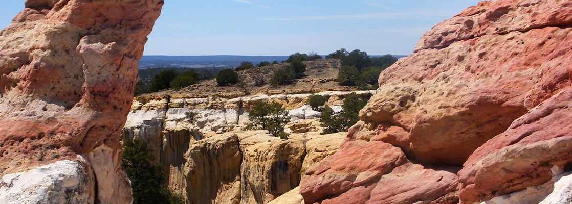 Red, orange and white sandstone, on top of Inscription Rock