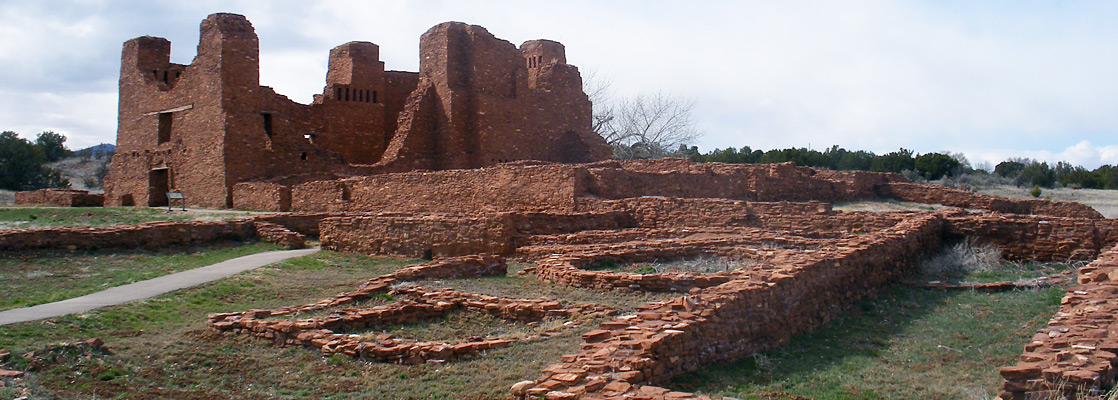 Ruins of the mission church at Quarai, including outbuildings and a kiva