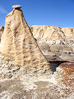 Small rock on wide column