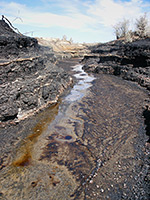 Oil flowing across coal