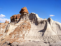 Boulders on top of soft sandstone