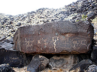 Boulder with many petroglyphs