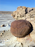 Spherical brown boulder