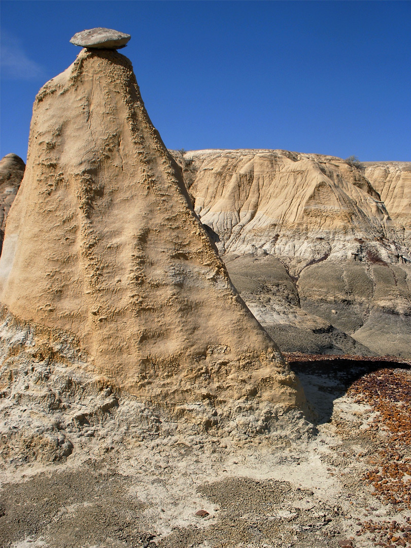 Small rock on wide column