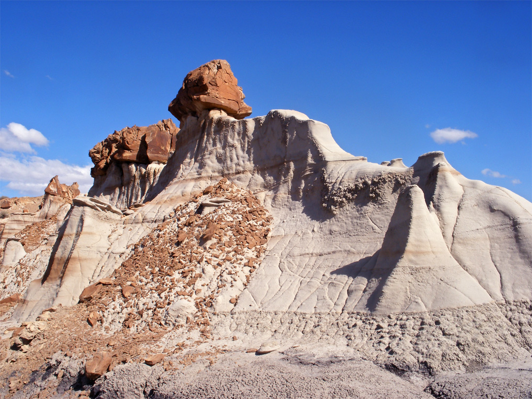 Boulders on top of soft sandstone