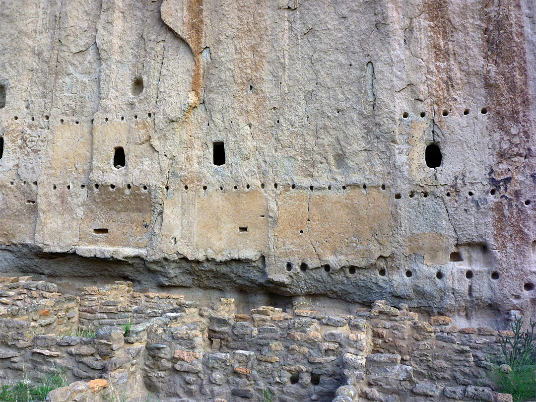 Post holes in a cliff