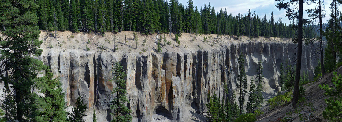 Grey scoria cliffs with vertical fractures