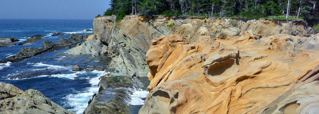 Swirling orange sandstone at Shore Acres