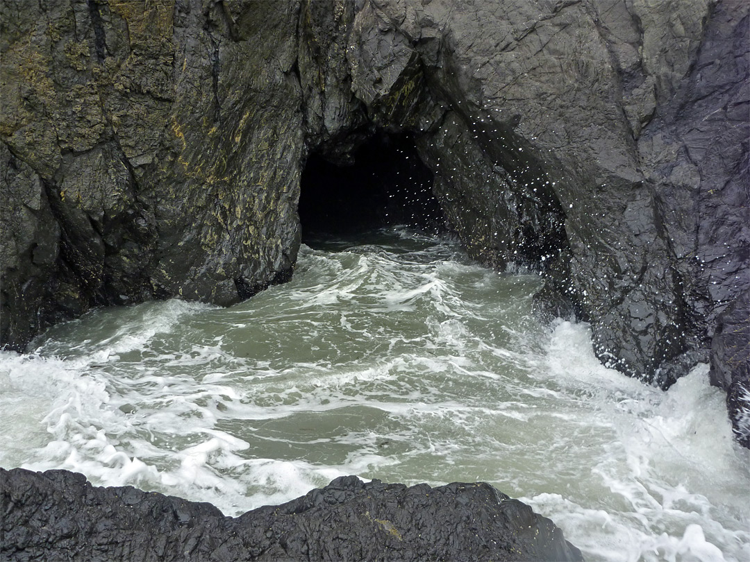 Waves by a cave