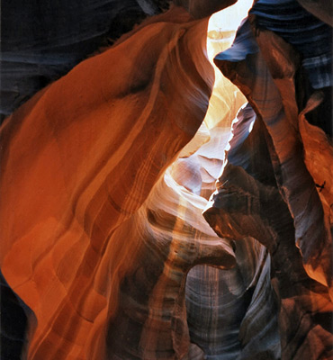 Eroded, curving, reddish rocks