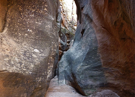 Narrows leading to a dryfall and boulders