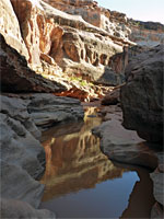 Cliffs above a pool